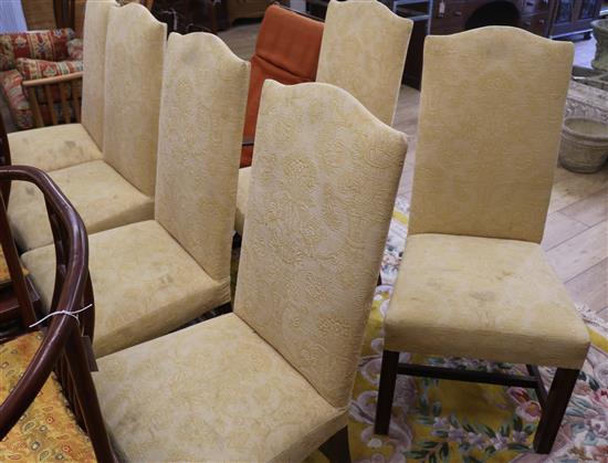 A set of six George III style mahogany framed pale yellow brocade upholstered dining chairs